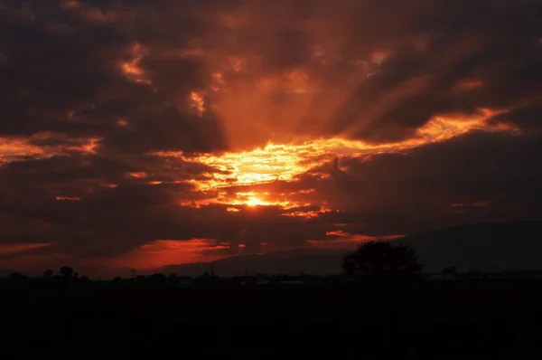 The sight of the sunrise. A moving moment of nature created by the sun and clouds.