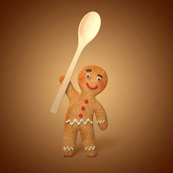 Gingerbread man holding wooden spoon — Stock Photo, Image