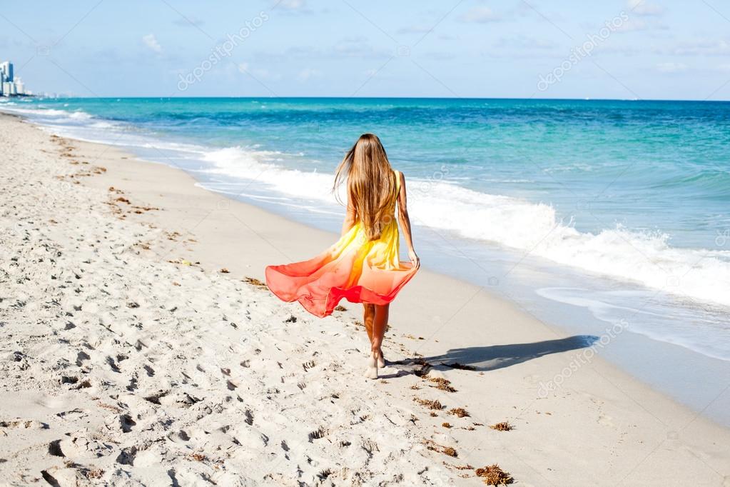 Girl walking on the beach