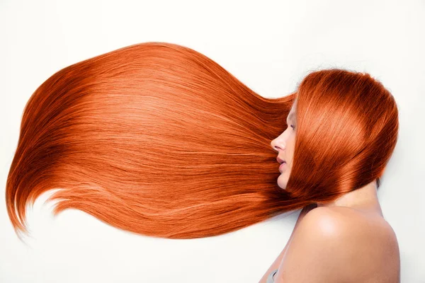 Beautiful girl with long red hair — Stock Photo, Image