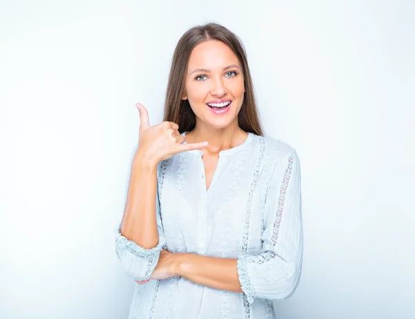 Woman showing "call me" gesture — Stock Photo, Image