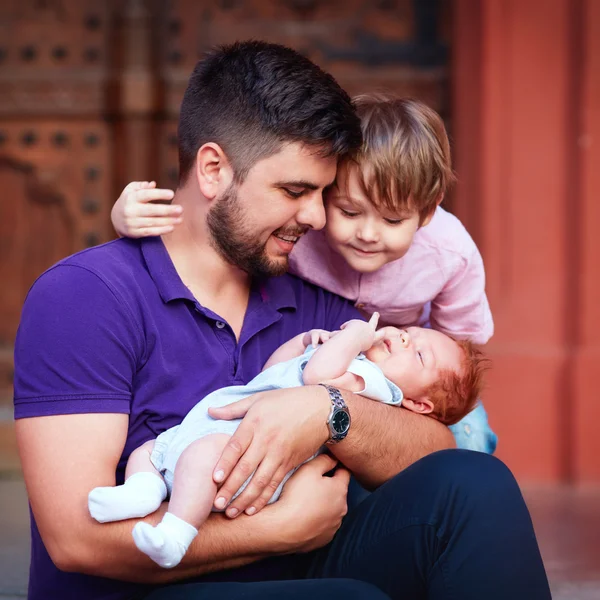 Portrait of happy father with newborn baby and son — Stock Photo, Image