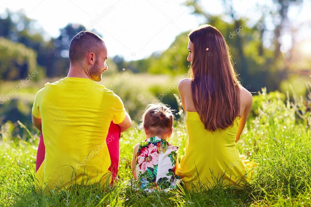 happy family on summer field