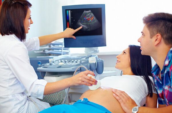 happy couple on ultrasound, determines the gender of child