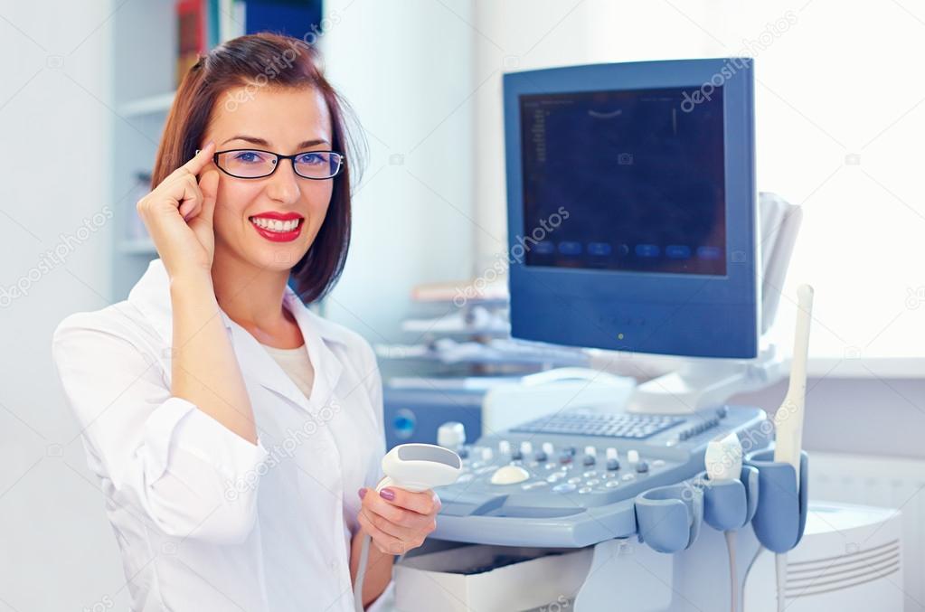 cheerful female doctor with ultrasound sensor