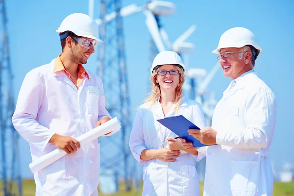 Group of engineers on wind power station — Stock Photo, Image