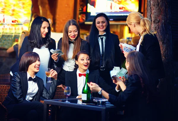 Elegant fashionable women gambling in night club — Stock Photo, Image