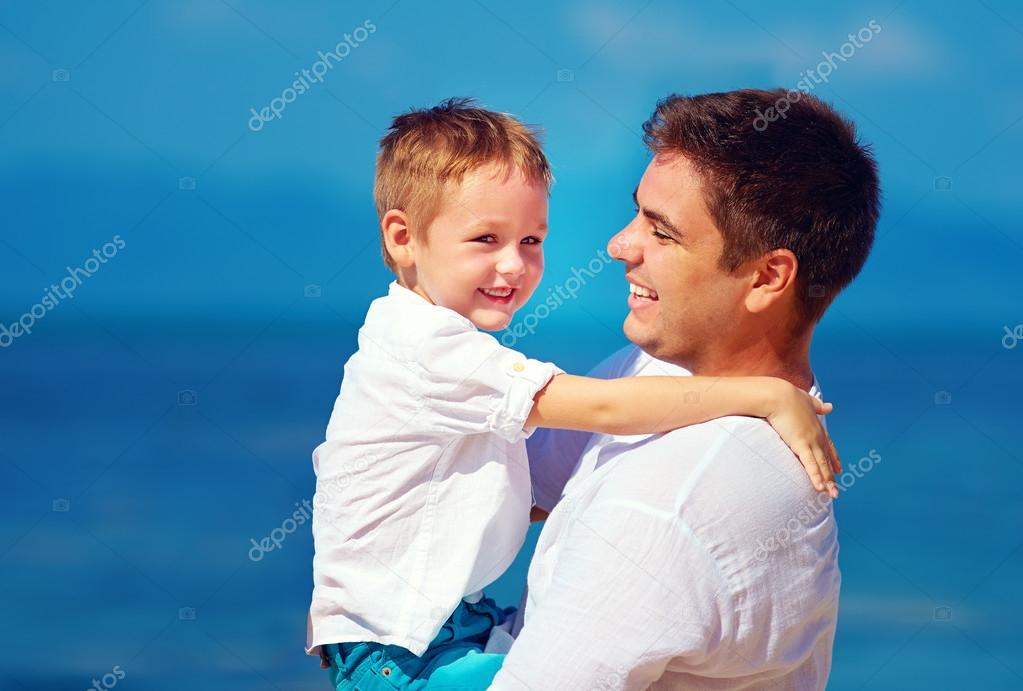 happy father and son embracing, family relationship