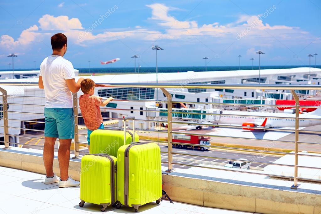 family waiting for boarding in international airport, summer vacation