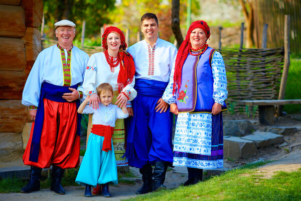 portrait of happy ukrainian family in traditional costumes