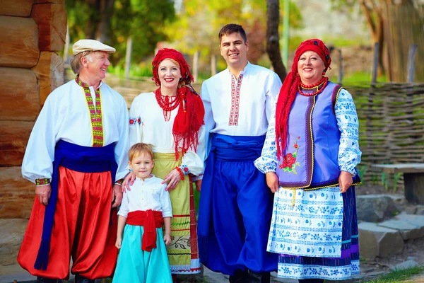 Portrait of happy ukrainian family in traditional costumes — Stock Photo, Image