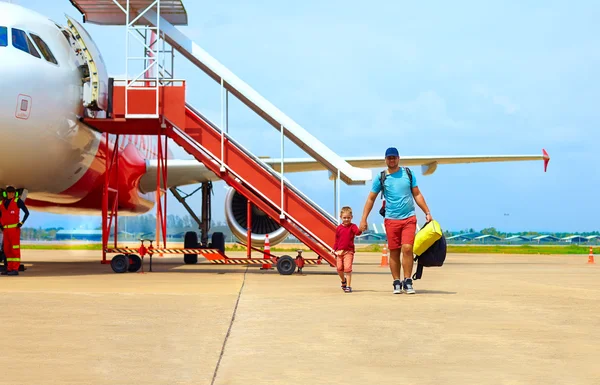 family, passengers leave the airplane after flight trip