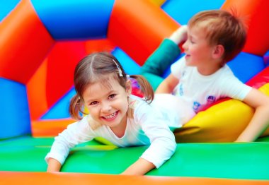 happy kids having fun on playground in kindergarten clipart