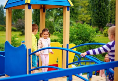 group of happy kids having fun on playground