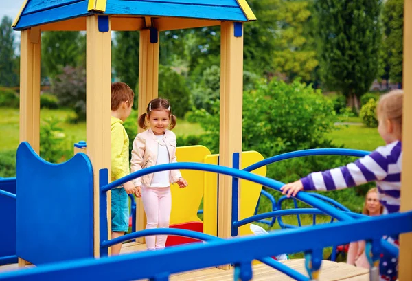 Group of happy kids having fun on playground — Zdjęcie stockowe