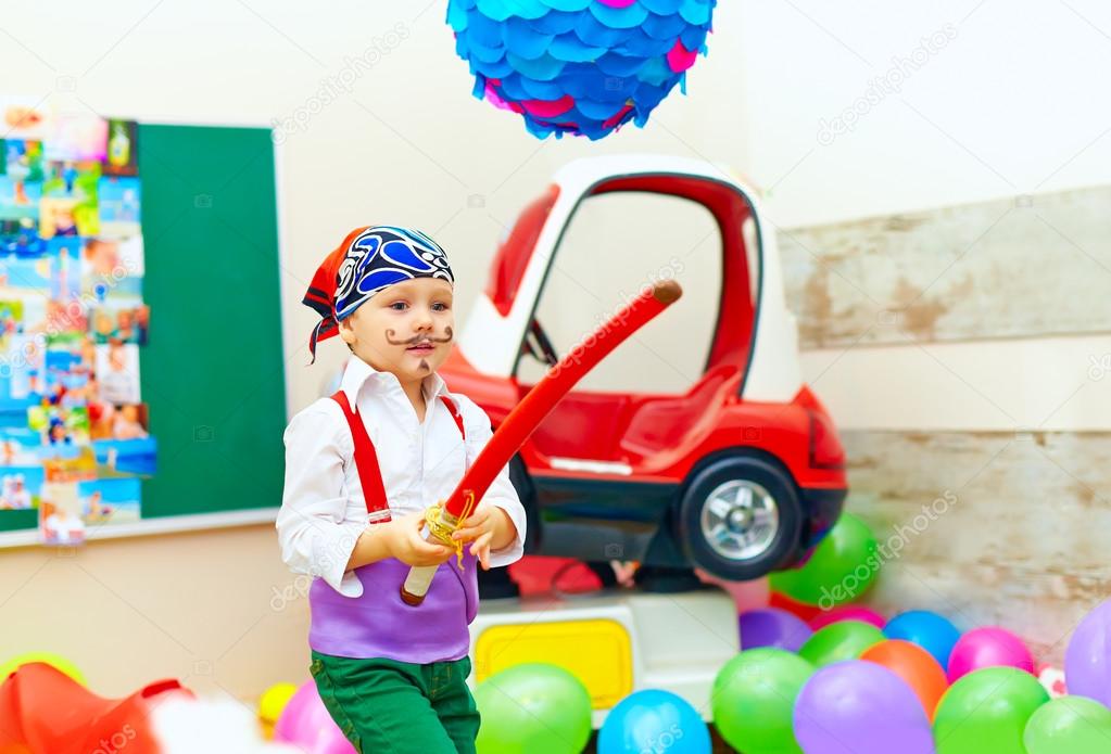 cute kid, boy dressed like pirate on playground