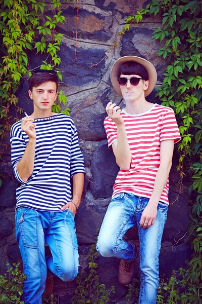 Portrait of young male couple near the wall — Stock Photo, Image