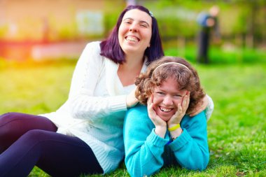 portrait of happy women with disability on spring lawn clipart