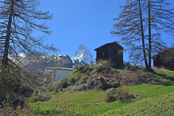 The Matterhorn above an old wood cabin in the Swiss Alps above Zermatt