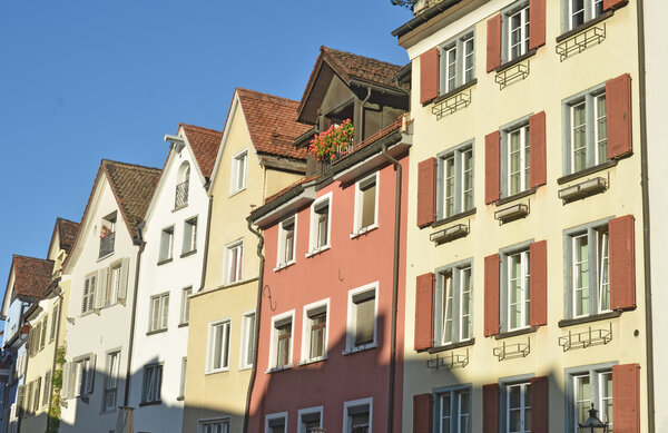 A row of brghtly painted town houses in a swiss town
