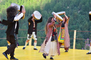 Turkish dancers with large tambourines
