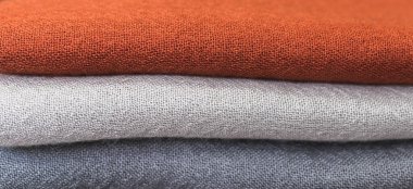 turuncu gri beyaz yün kazak, renkli kumaş kaplama, bir yığın kaşmir tekstil, renkli kıyafetler, bir yığın elbise