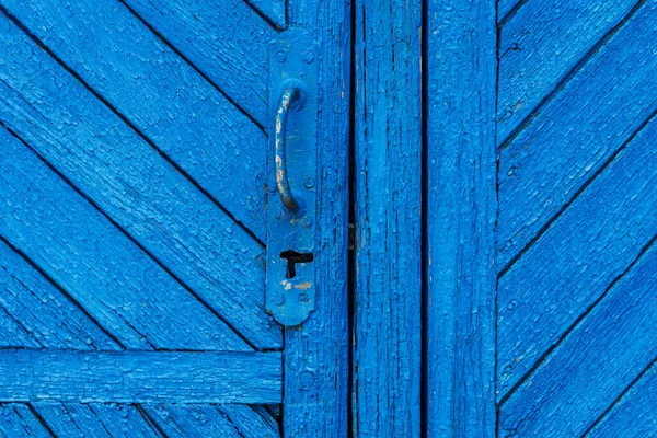 De houten textuur van de planken deur, geschilderd blauw — Stockfoto