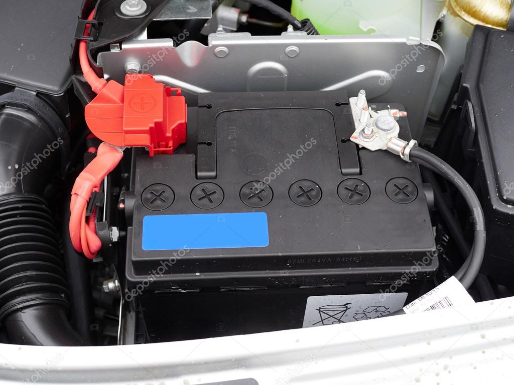 Car with open hood.Battery.