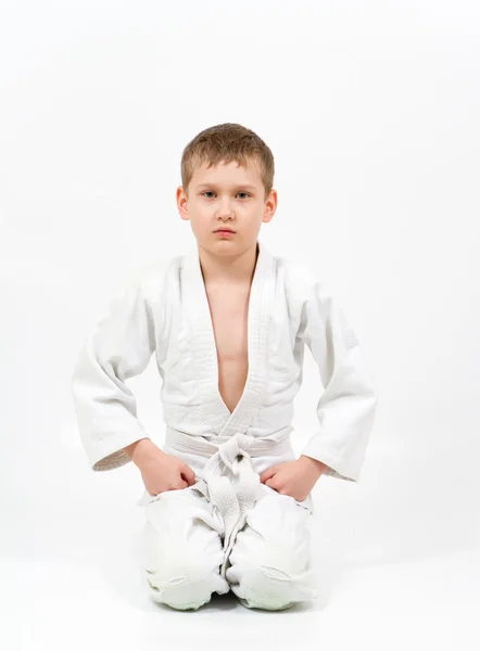 Karate boy in white kimono fighting — Stock Photo, Image