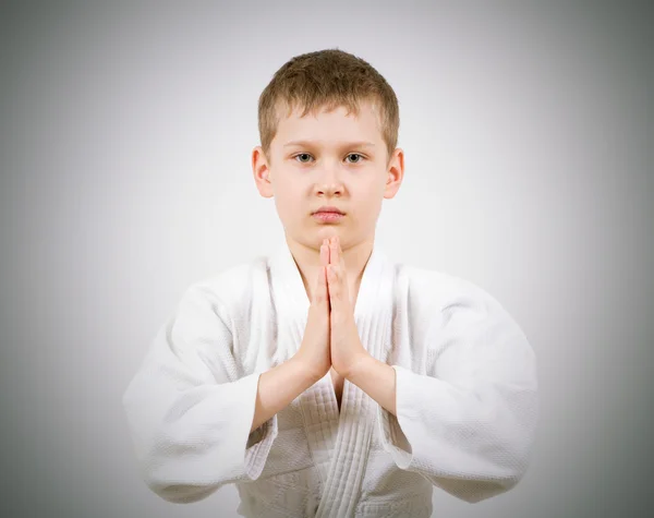 Karate boy in white kimono fighting — Stock Photo, Image