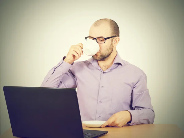 man with beard in glasses laptop