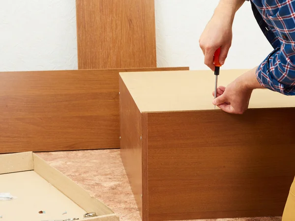 Man collects furniture. — Stock Photo, Image