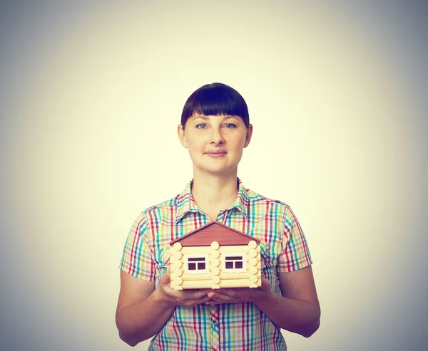Girl holding a house — Stock Photo, Image