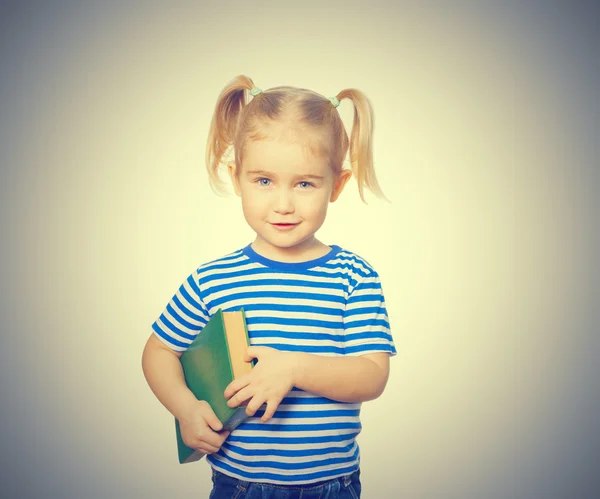 Pequeña chica divertida con libros . — Foto de Stock