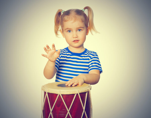 Little Funny girl  play drum.