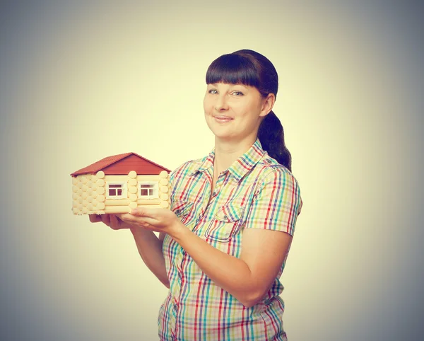 Girl holding a house — Stock Photo, Image