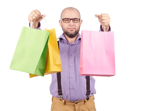 Homem com sacos de papel de compras coloridos — Fotografia de Stock