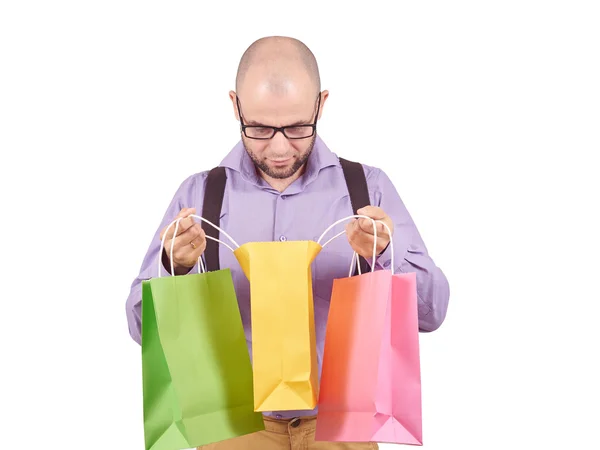 Homem com sacos de papel de compras coloridos — Fotografia de Stock