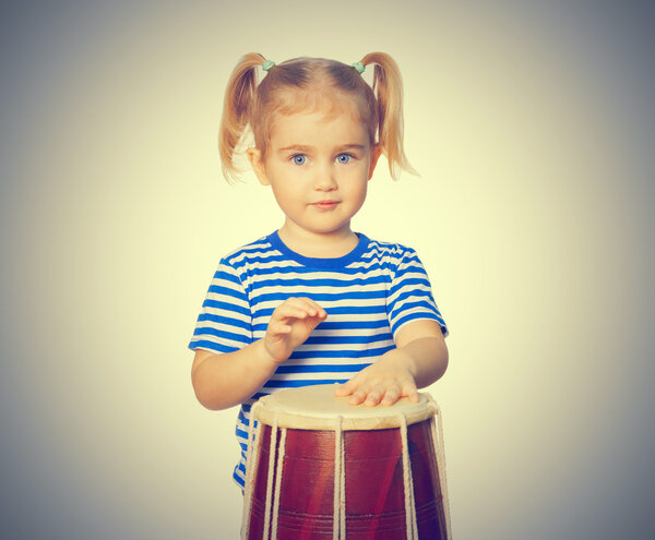 Little Funny girl  play drum.