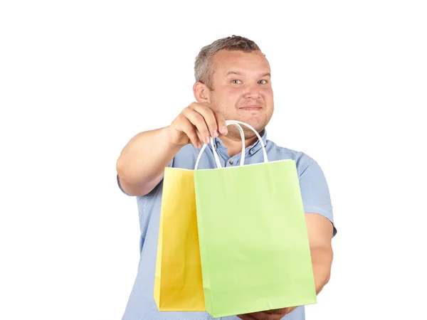 Caucasiano homem gordo, com sacos de papel de compras coloridos — Fotografia de Stock