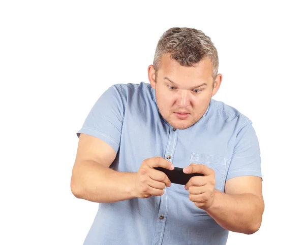 Hombre gordo mira el teléfono . —  Fotos de Stock