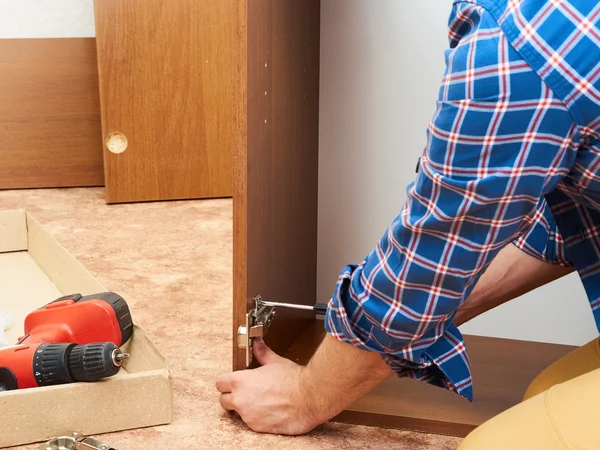 Man collects furniture. — Stock Photo, Image