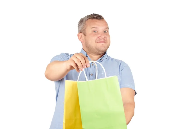 Homme caucasien gras, avec des sacs en papier coloré — Photo