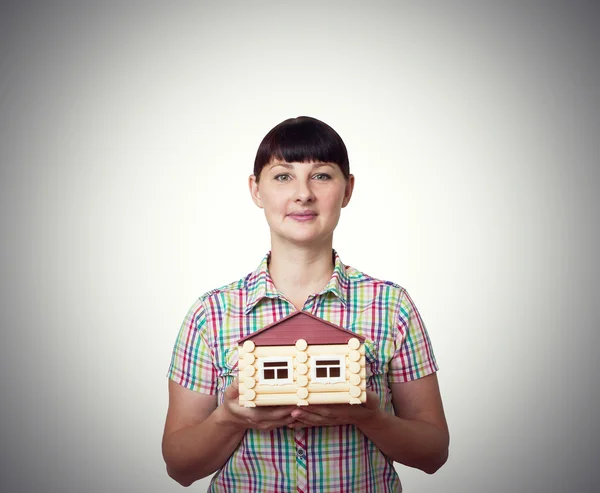 Girl holding a house — Stock Photo, Image