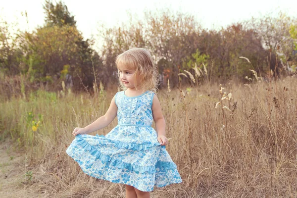 Funny girl dancing on the lawn — Stock Photo, Image