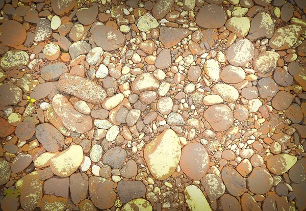 Hintergrund aus Steinen unterschiedlicher Form. — Stockfoto