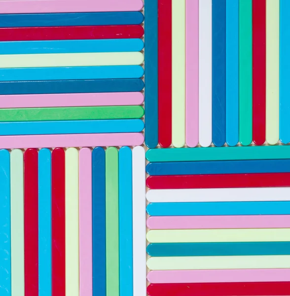 Colorful striped background. Plastique sticks of different color — Stock Photo, Image