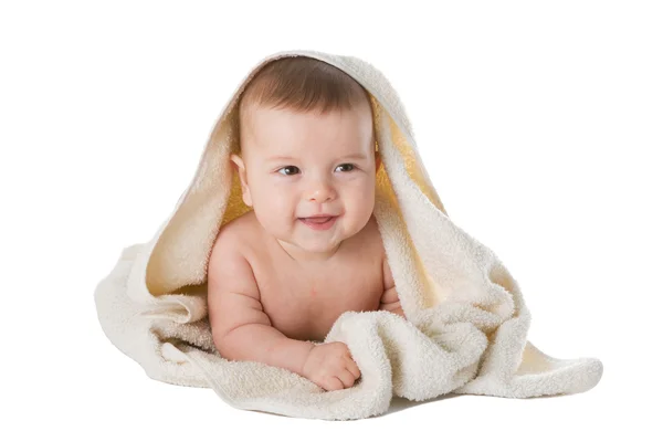 Baby in towel is isolated on a white background. Stock Picture