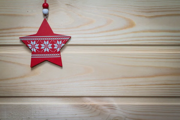 Christmas wooden background decorated with a toy. — Stock Photo, Image