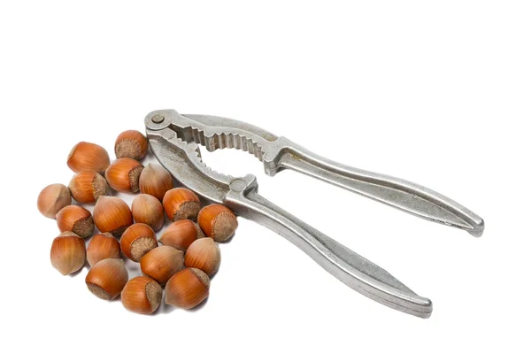 Metal pliers to crack nuts and hazelnuts — Stock Photo, Image
